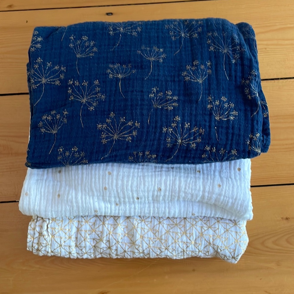 Blue and gold Aden Anais swaddles.